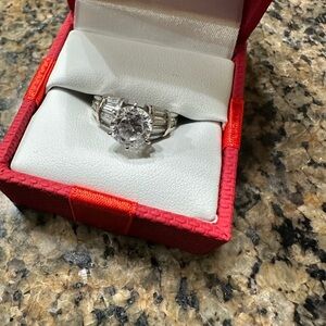 14 Karat white gold and simulated cubic zirconia, stamped inside.